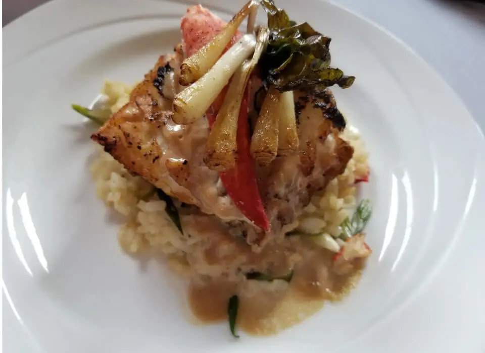Elegant seafood meal with grilled garnishes