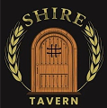 A rustic wooden door with 'Shire Tavern' text and wheat motifs.