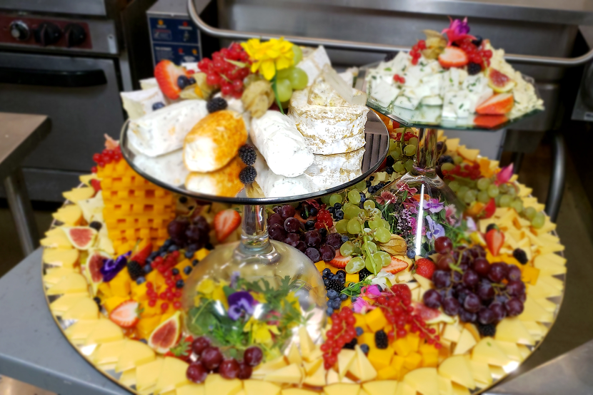 Elegant dessert and fruit display with vibrant colors and delicate pastries.